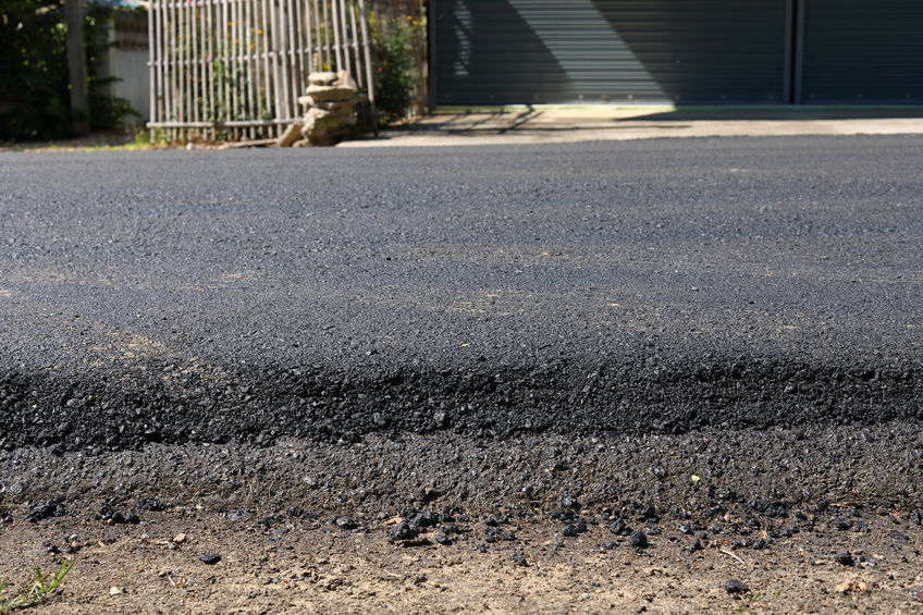 black asphalt construction road repairing new surface level on old with tarmac material exterior industry