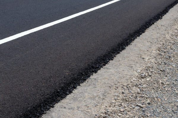 Background, oblique angle, paved road surface, on the concrete floor, pebbles in the countryside.
